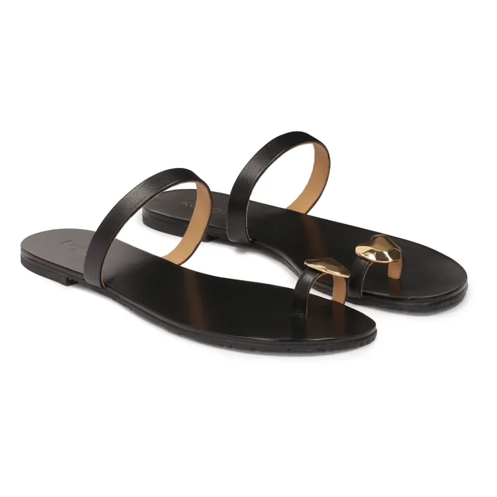 Kazar Sandaler*Minimalistiske e mules på en flad sål Sort